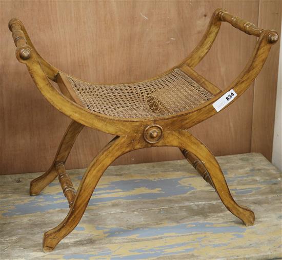 An X frame stool with caned bergere seat W.62cm (a.f.)